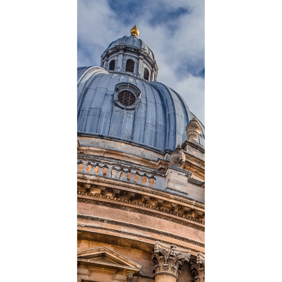 The Radcliffe Camera (in Oxford) in front of a blue cloudy sky. 